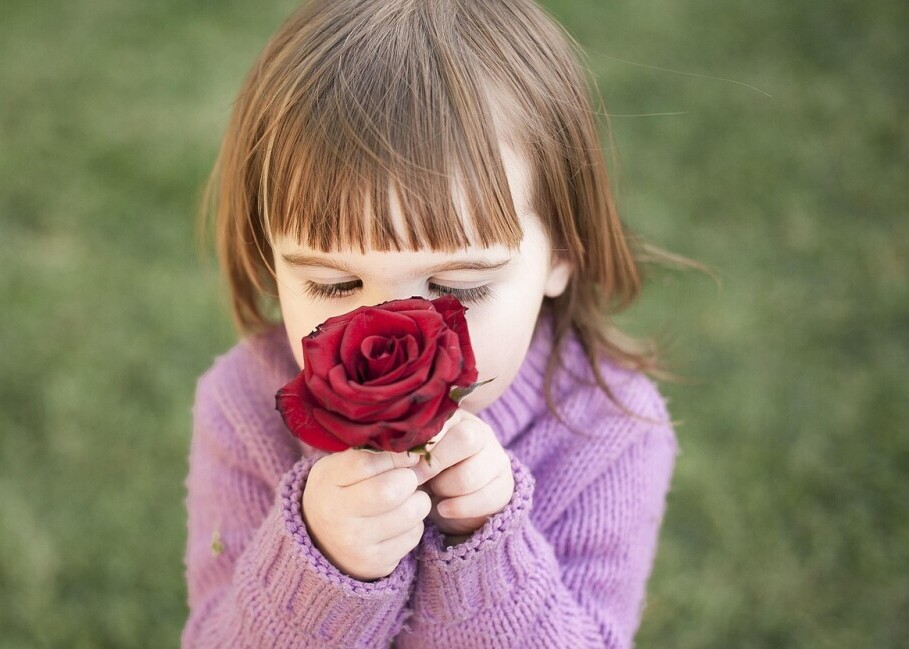 lady smelling roses