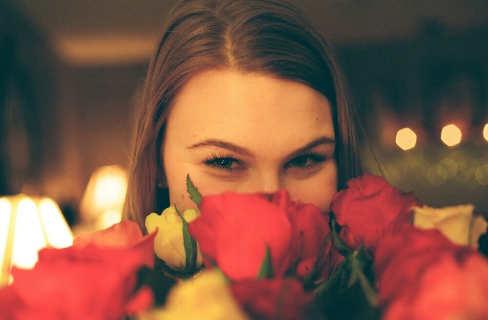 lady smelling roses
